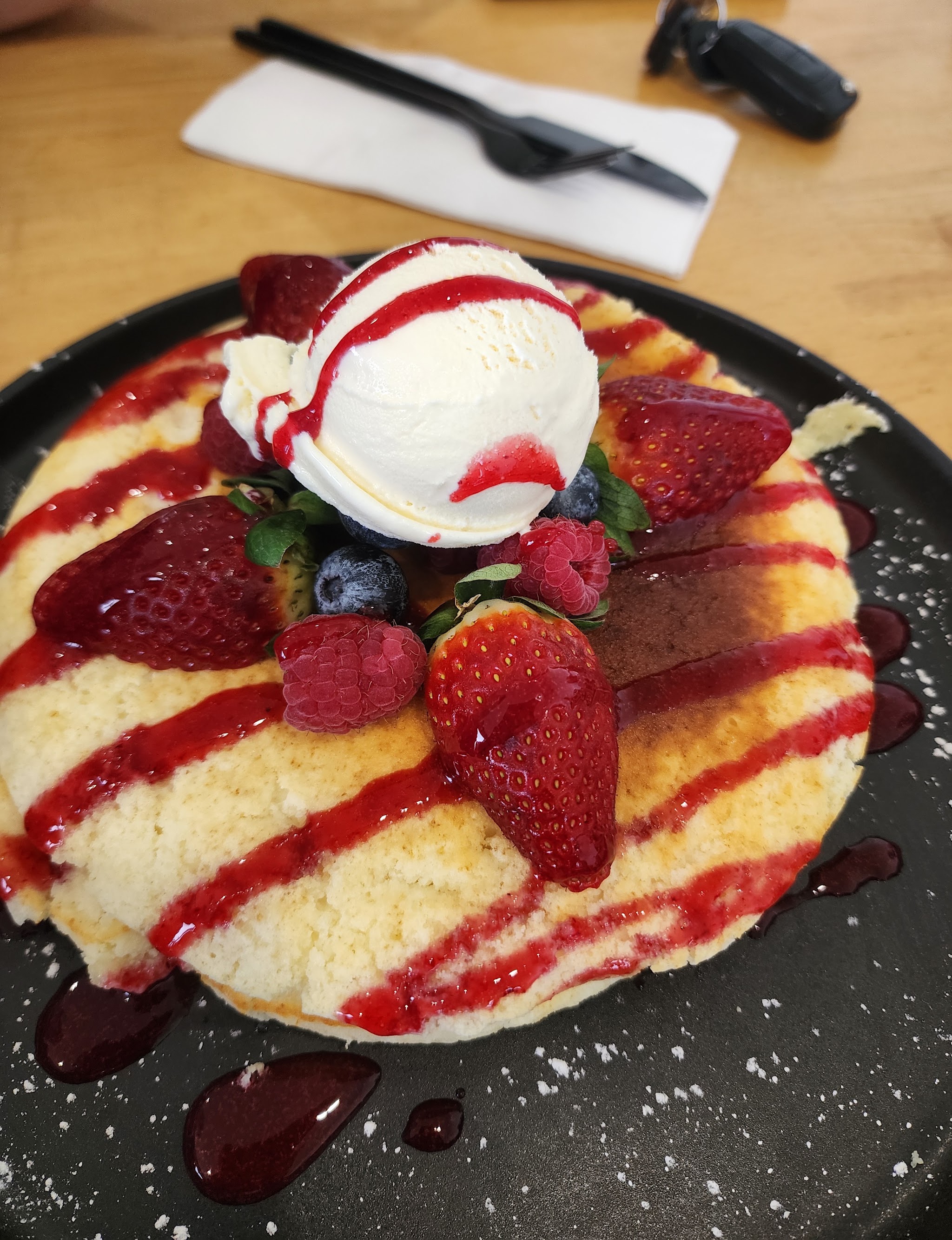 Buttermilk pancake stack with fresh berries and ice cream